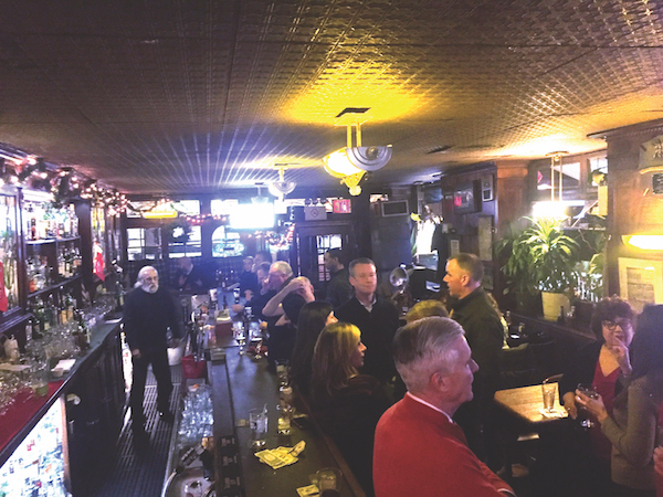 A crowd packs Peter McManus Cafe, which has been in business on Seventh Ave. since 1932. File photo by Dennis Lynch